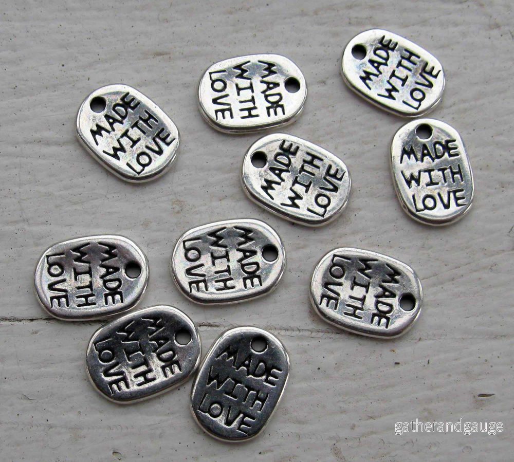 Berlock silverfärgad - Oval 'made with love', 10-pack