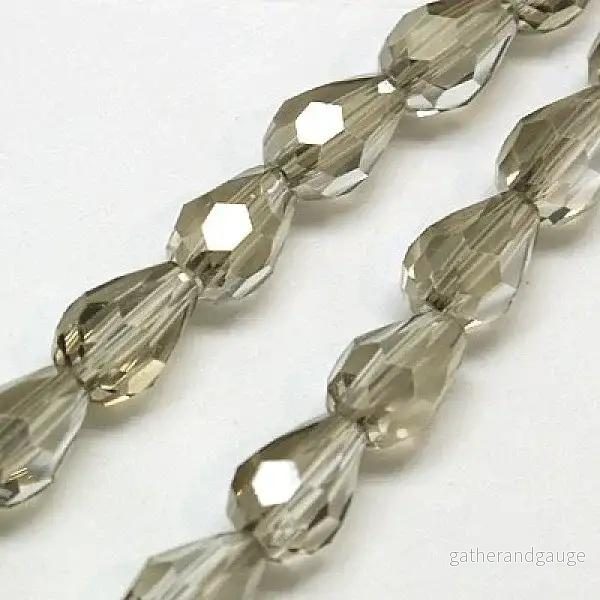 Facetterade droppar – Rökgrå, 12x8mm, 1 sträng Facetterade droppar – Rökgrå, 12x8mm, 1 sträng