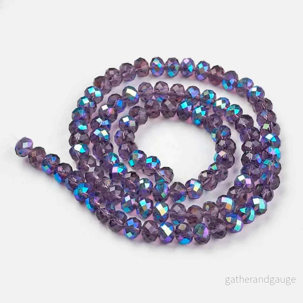 Facetterade glaspärlor – Lila med indigolyster 4x3mm 1 sträng Facetterade glaspärlor – Lila med indigolyster 4x3mm 1 sträng